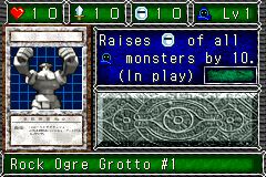 Rock Ogre Grotto #1 (岩窟魔人オーガ・ロック) — level 1 Spellcaster — 1 heart, attack 10, defence 10 — faces Sum Sum Sum Sum Tra Mag2 — Raises DEF of all Spellcaster monsters by 10. (In play)